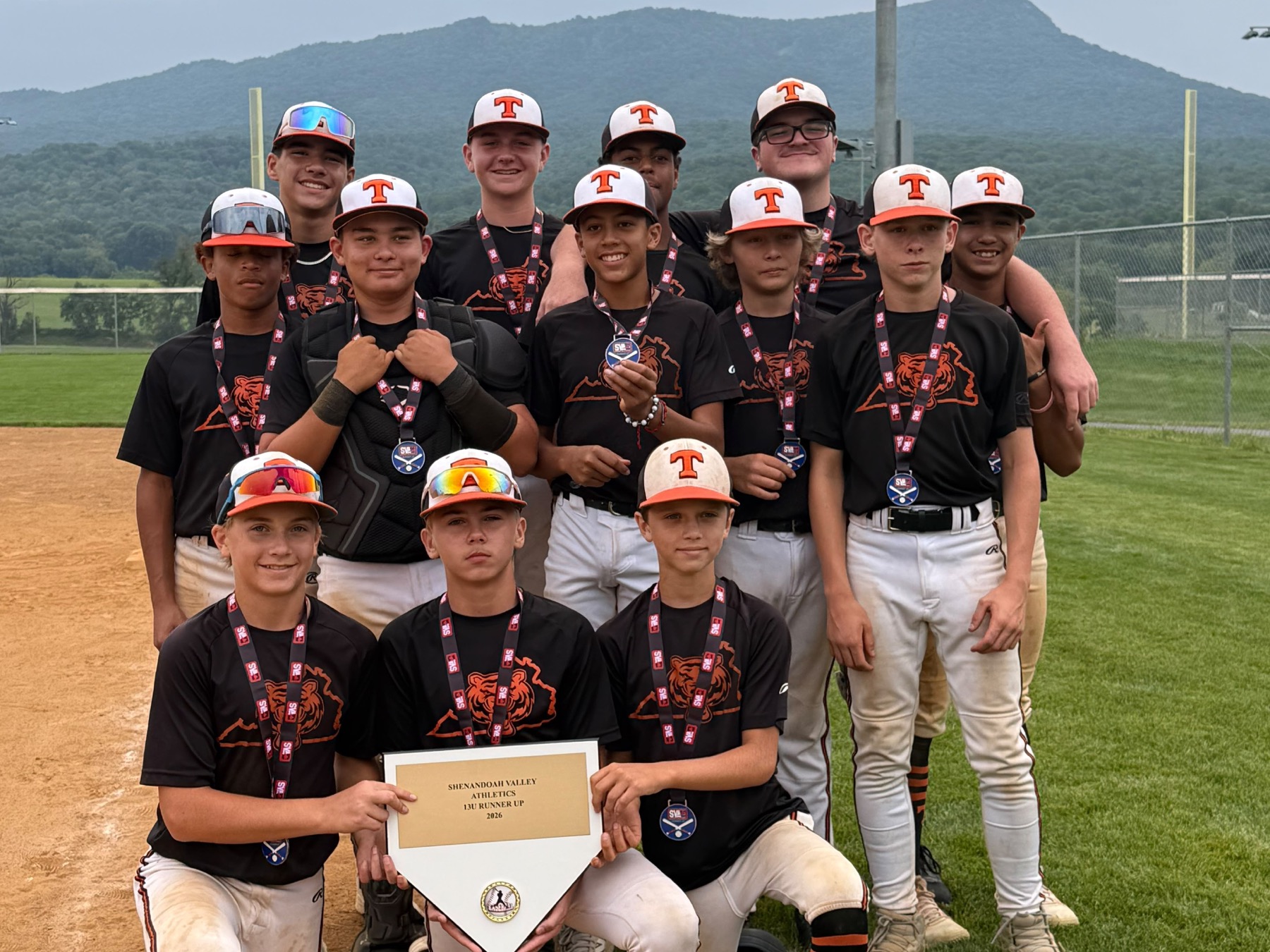 Rawlings Tigers NOVA 13U Black players wearing medals and holding their Shenandoah Valley Athletics runner-up banner