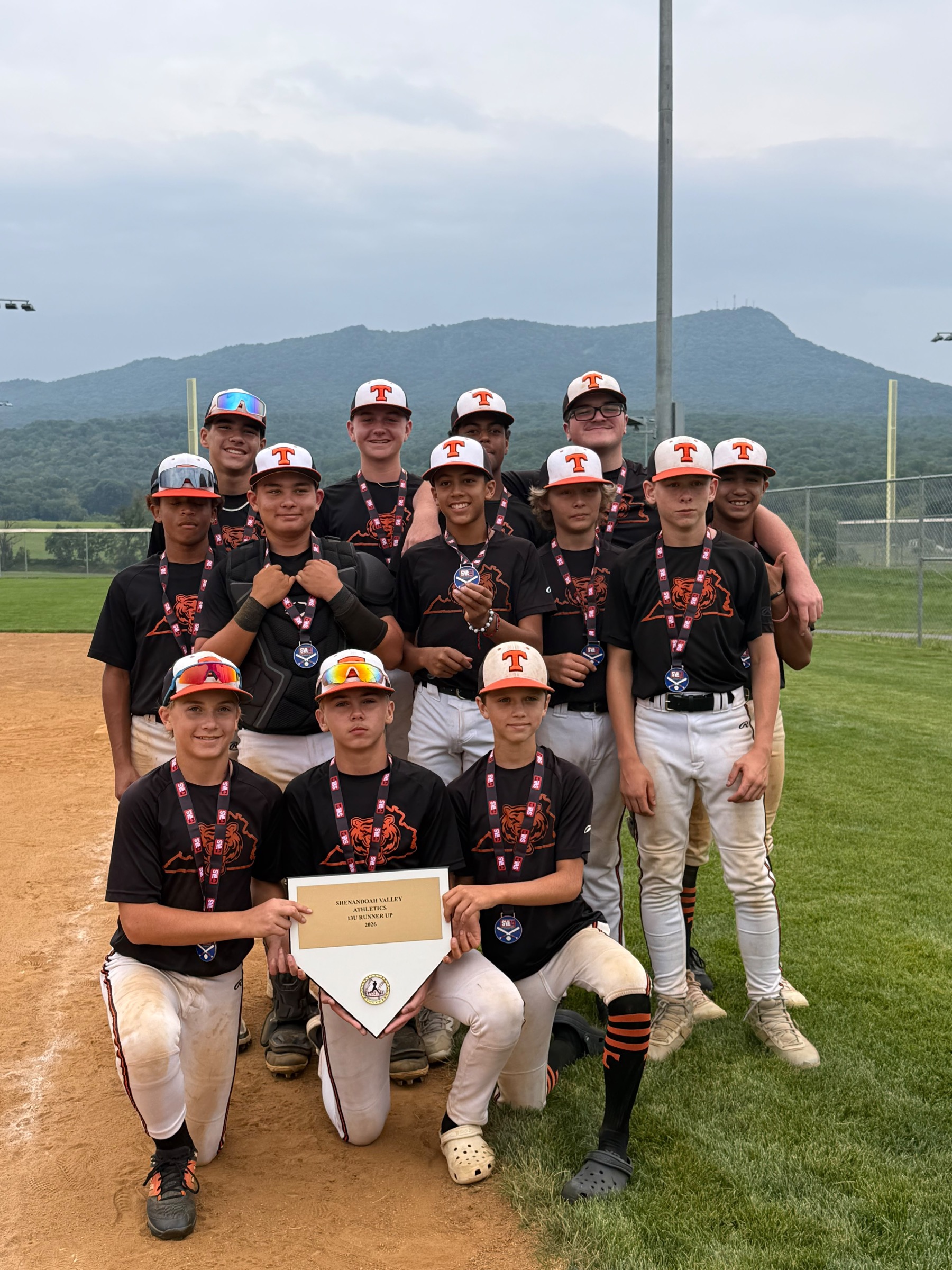 Rawlings Tigers NOVA 13U Black players wearing medals and holding their Shenandoah Valley Athletics runner-up banner